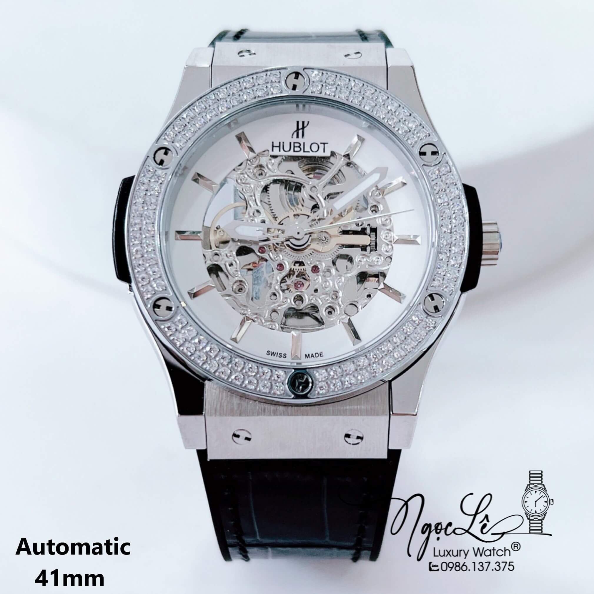 Đồng Hồ Hublot Nam Tự Động Lộ Máy Dây Da Silicon Đen Đính Đá Bạc Size 41mm