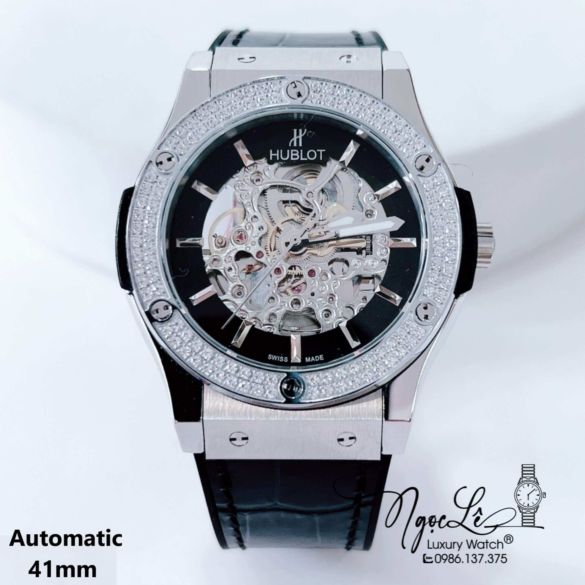 Đồng Hồ Hublot Nam Tự Động Lộ Máy Dây Da Silicon Đen Đính Đá Bạc Size 41mm