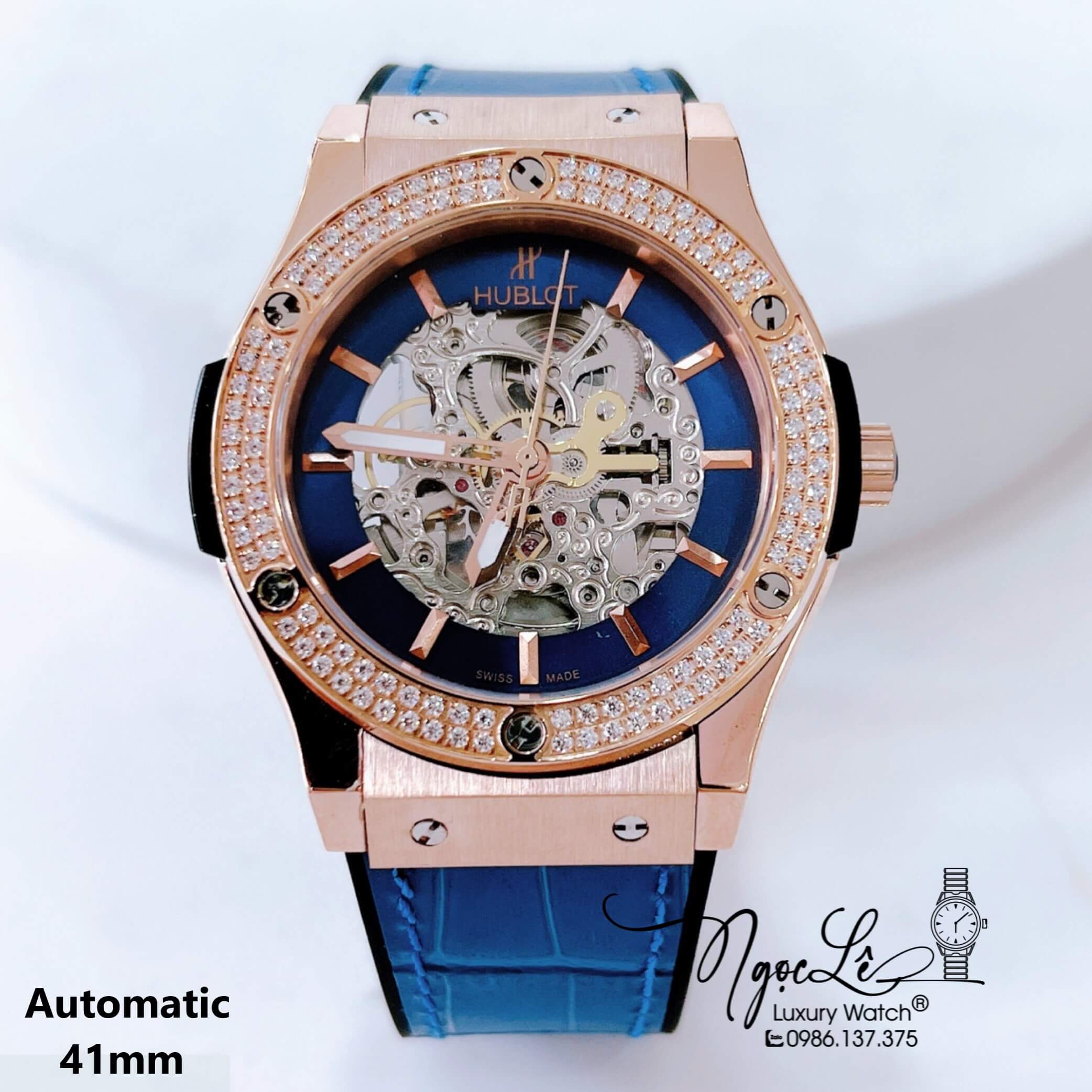 Đồng Hồ Hublot Nam Tự Động Lộ Máy Dây Da Silicon Xanh Dương Đính Đá Rose Size 41mm