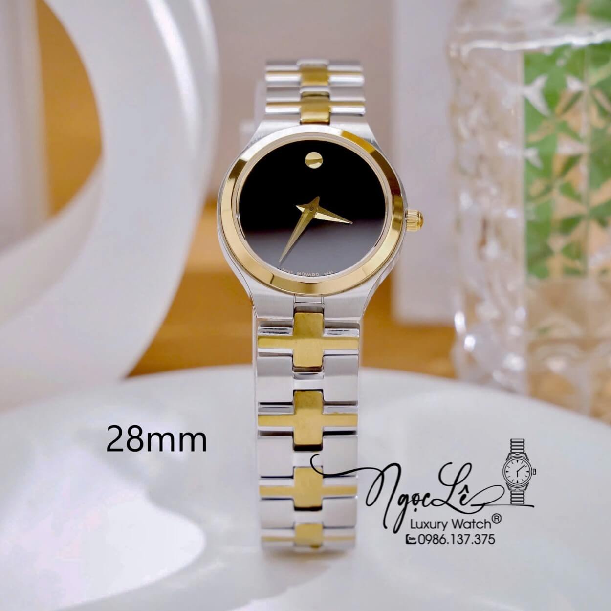 Đồng Hồ Cặp Movado Dây Kim Loại Demi Vàng Mặt Đen Cao Cấp Máy Pin Size 40mm - 28mm