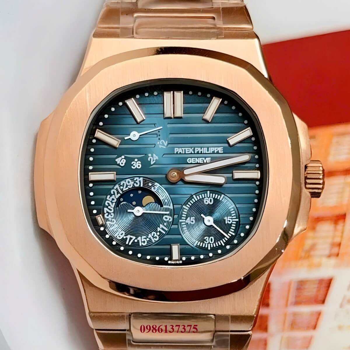 Đồng Hồ Nam Patek Philippe Nautilus 5712 Máy Tự Động Mặt Xanh Dây Kim Loại Vàng Hồng Size 40mm