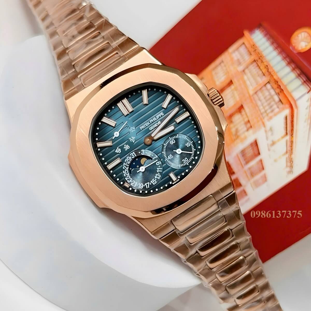 Đồng Hồ Nam Patek Philippe Nautilus 5712 Máy Tự Động Mặt Xanh Dây Kim Loại Vàng Hồng Size 40mm