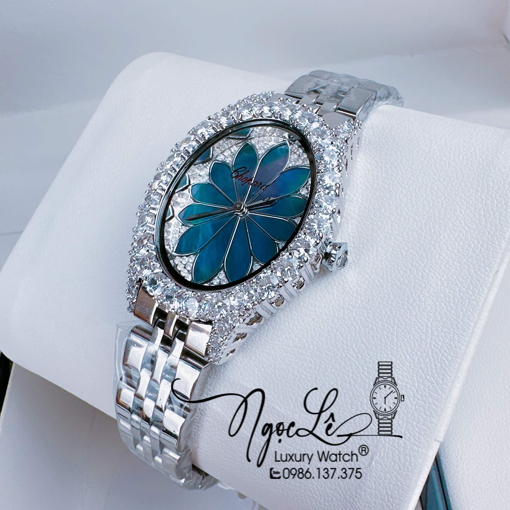 Đồng Hồ Nữ Chopard Mặt Oval Họa Tiết Hoa Xà Cừ Màu Xanh Dây Kim Loại Silver Đính Đá Size 34mm