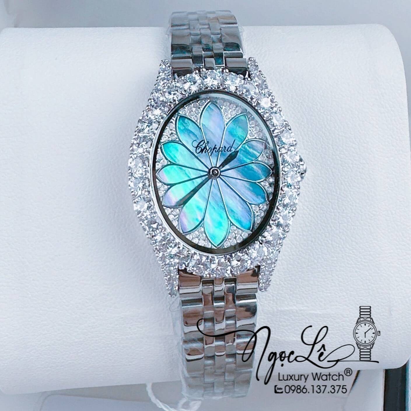 Đồng Hồ Nữ Chopard Mặt Oval Họa Tiết Hoa Xà Cừ Màu Xanh Dây Kim Loại Silver Đính Đá Size 34mm