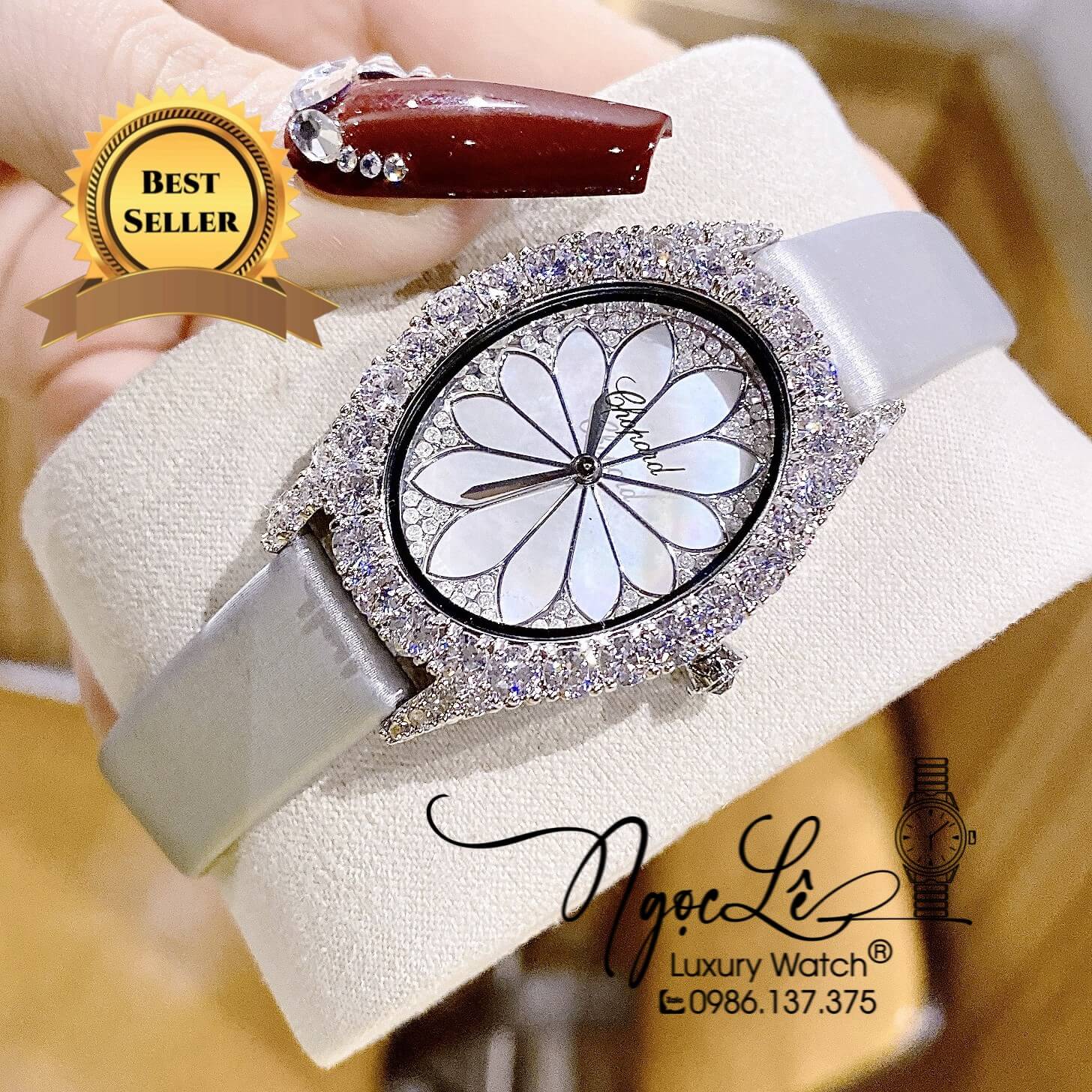 Đồng Hồ Nữ Chopard Mặt Oval Họa Tiết Hoa Xà Cừ Trắng Dây Da Lụa Màu Xám Vỏ Silver Đính Đá Size 34mm