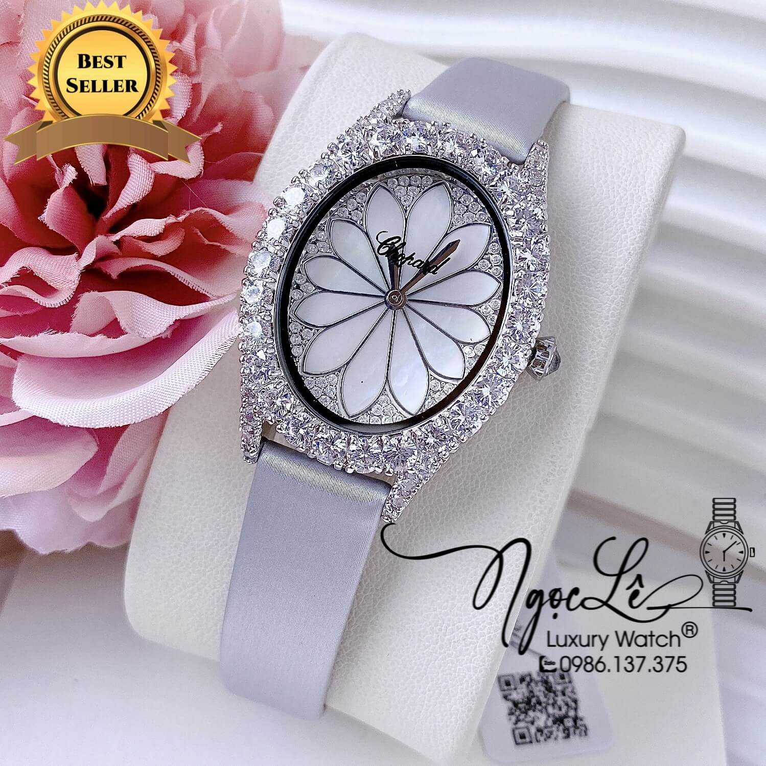 Đồng Hồ Nữ Chopard Mặt Oval Họa Tiết Hoa Xà Cừ Trắng Dây Da Lụa Màu Xám Vỏ Silver Đính Đá Size 34mm