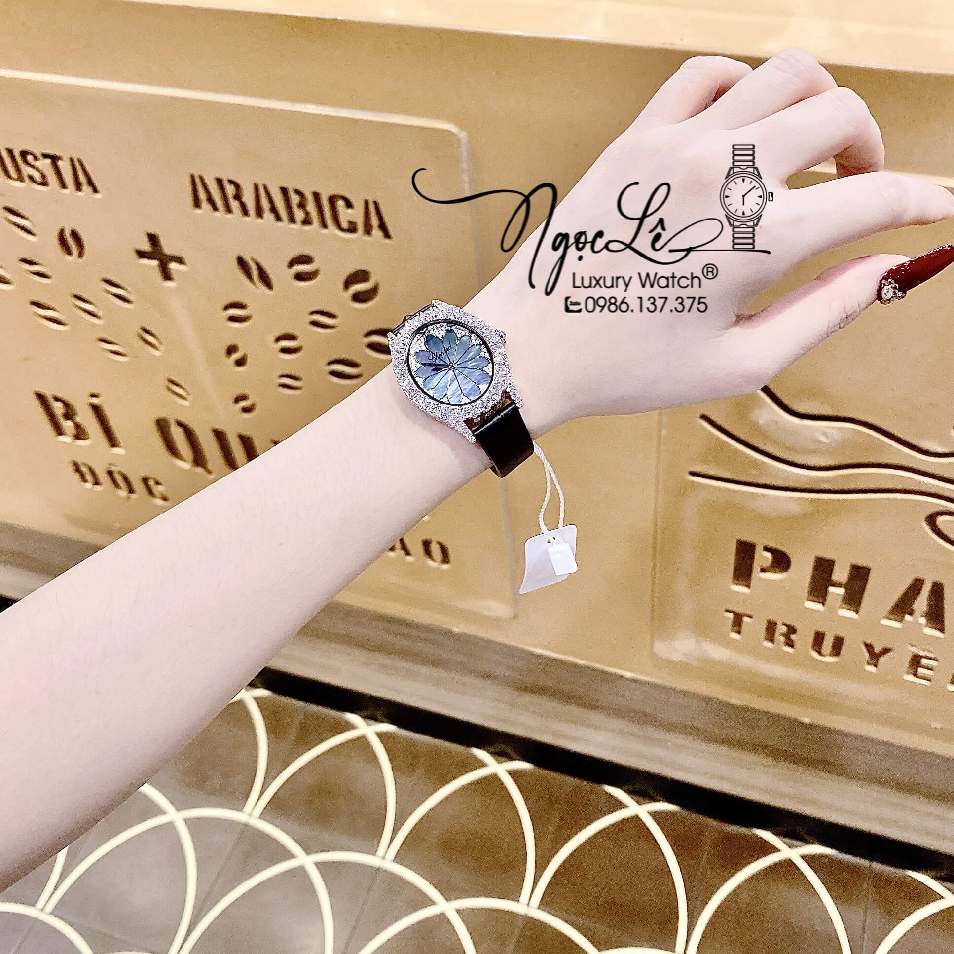 Đồng Hồ Nữ Chopard Mặt Oval Họa Tiết Hoa Xanh Xà Cừ Dây Da Lụa Màu Đen Vỏ Silver Đính Đá Size 34mm
