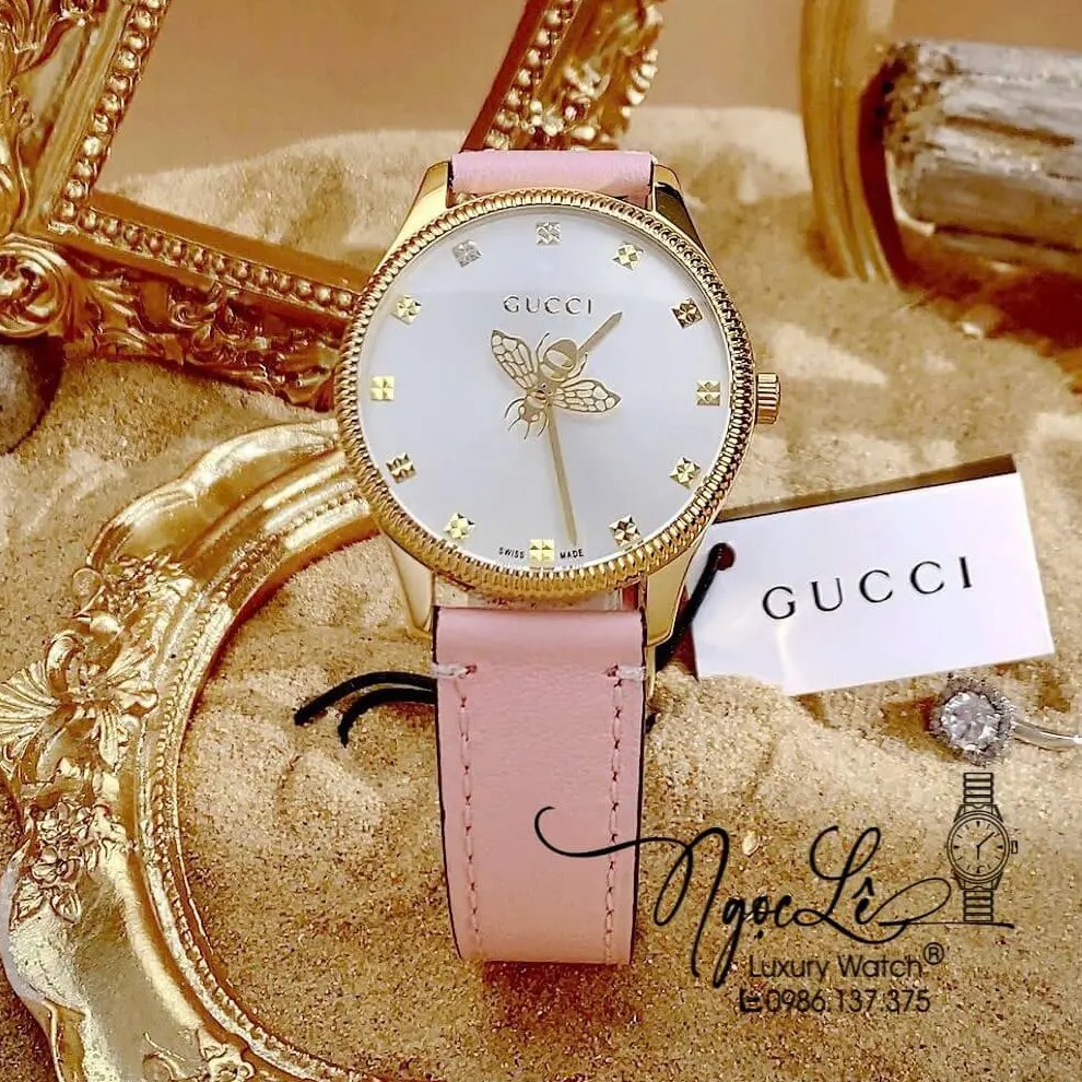 Đồng Hồ Nữ Gucci G-Timeless Dây Da Hồng Mặt Ong Size 36mm