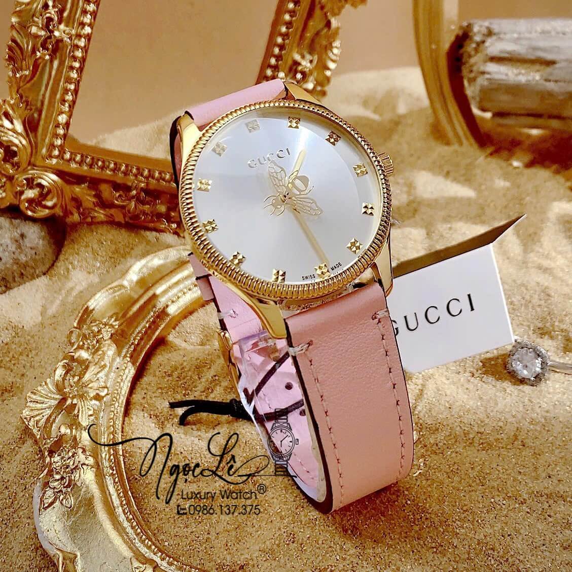 Đồng Hồ Nữ Gucci G-Timeless Dây Da Hồng Mặt Ong Size 36mm