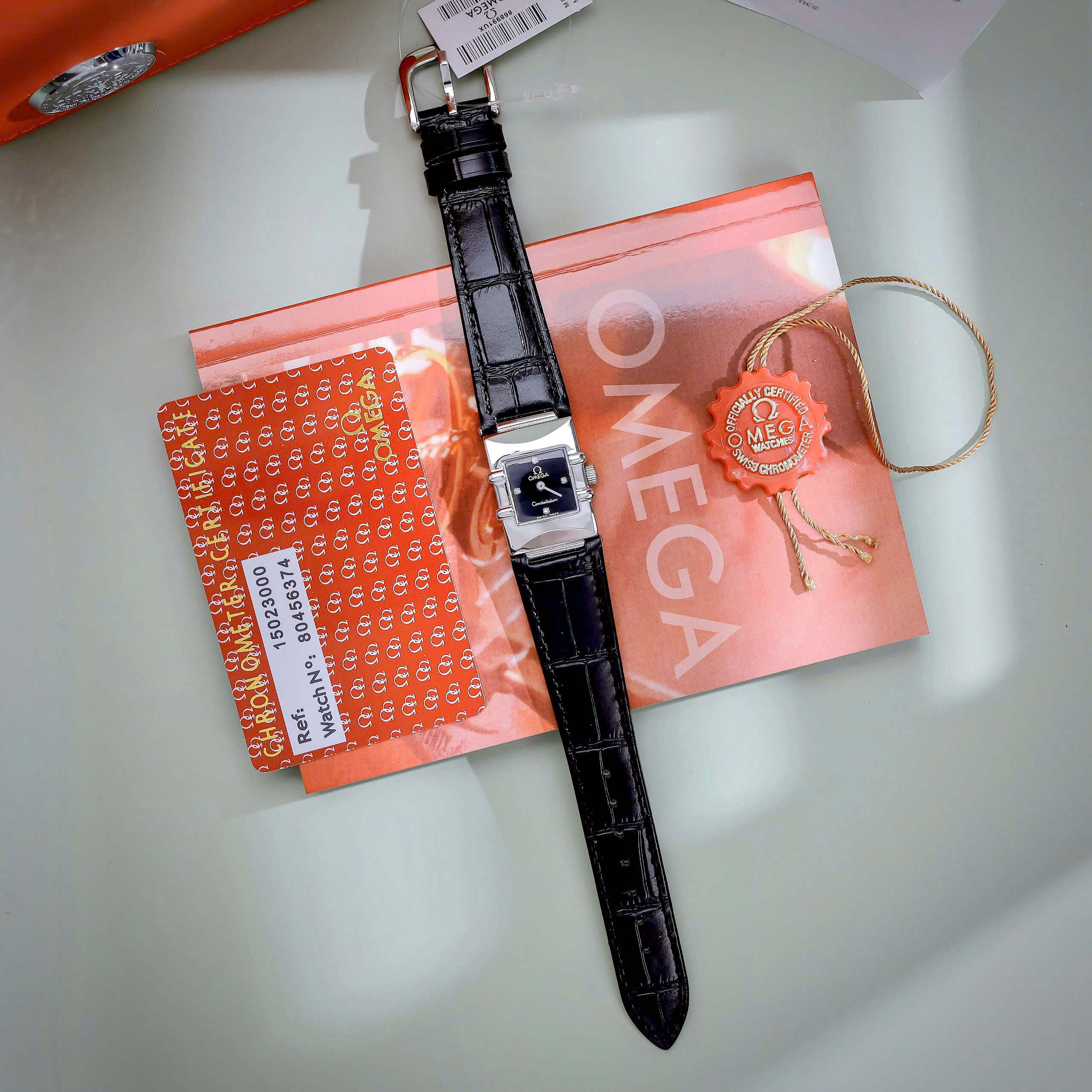 Đồng Hồ Nữ Omega Constellation Dây Da Màu Đen Mặt Vuông Niềng Trơn Size 22x28mm - Quartz Japan