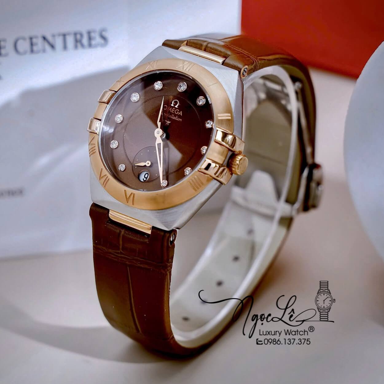 Đồng Hồ Nữ Omega Constellation Dây Da Nâu Vỏ Demi Rose Niềng Trơn Size 34mm - Quartz Japan