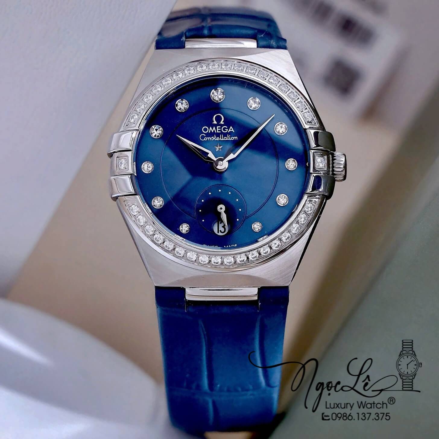 Đồng Hồ Nữ Omega Constellation Dây Da Xanh Kính Sapphire Vỏ Silver Size 34mm