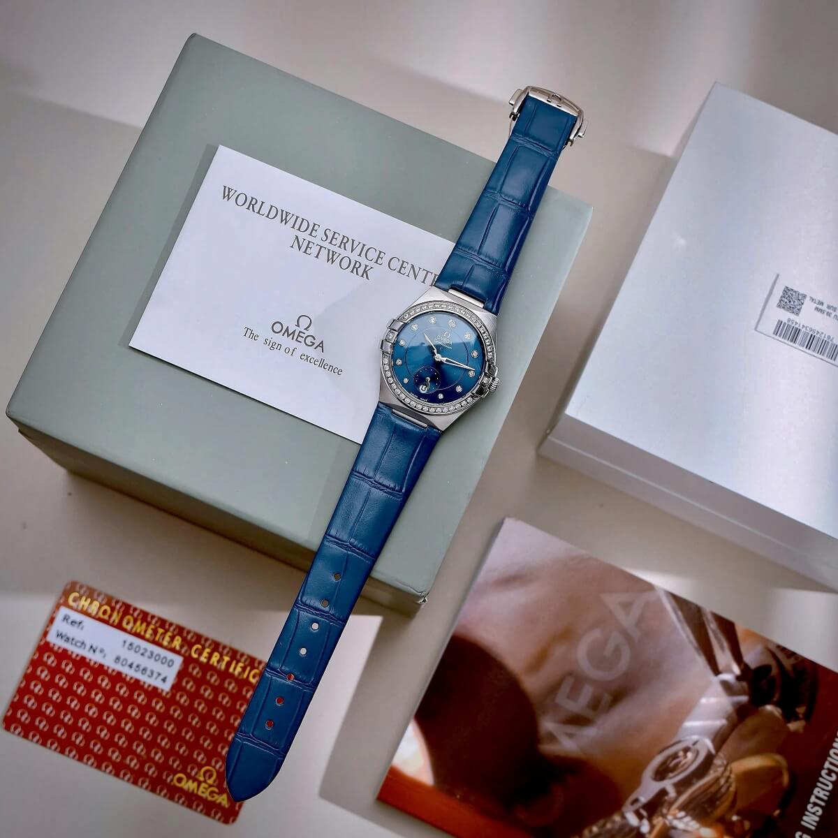 Đồng Hồ Nữ Omega Constellation Dây Da Xanh Kính Sapphire Vỏ Silver Size 34mm