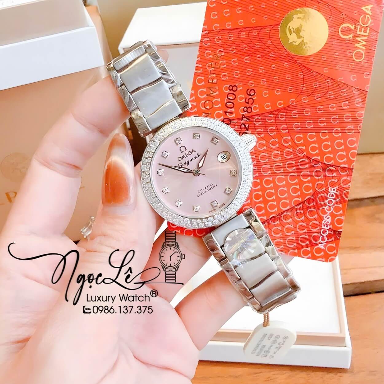 Đồng Hồ Nữ Omega De Ville Dây Kim Loại Silver Mặt Hồng Phấn Đính Đá Size 34mm