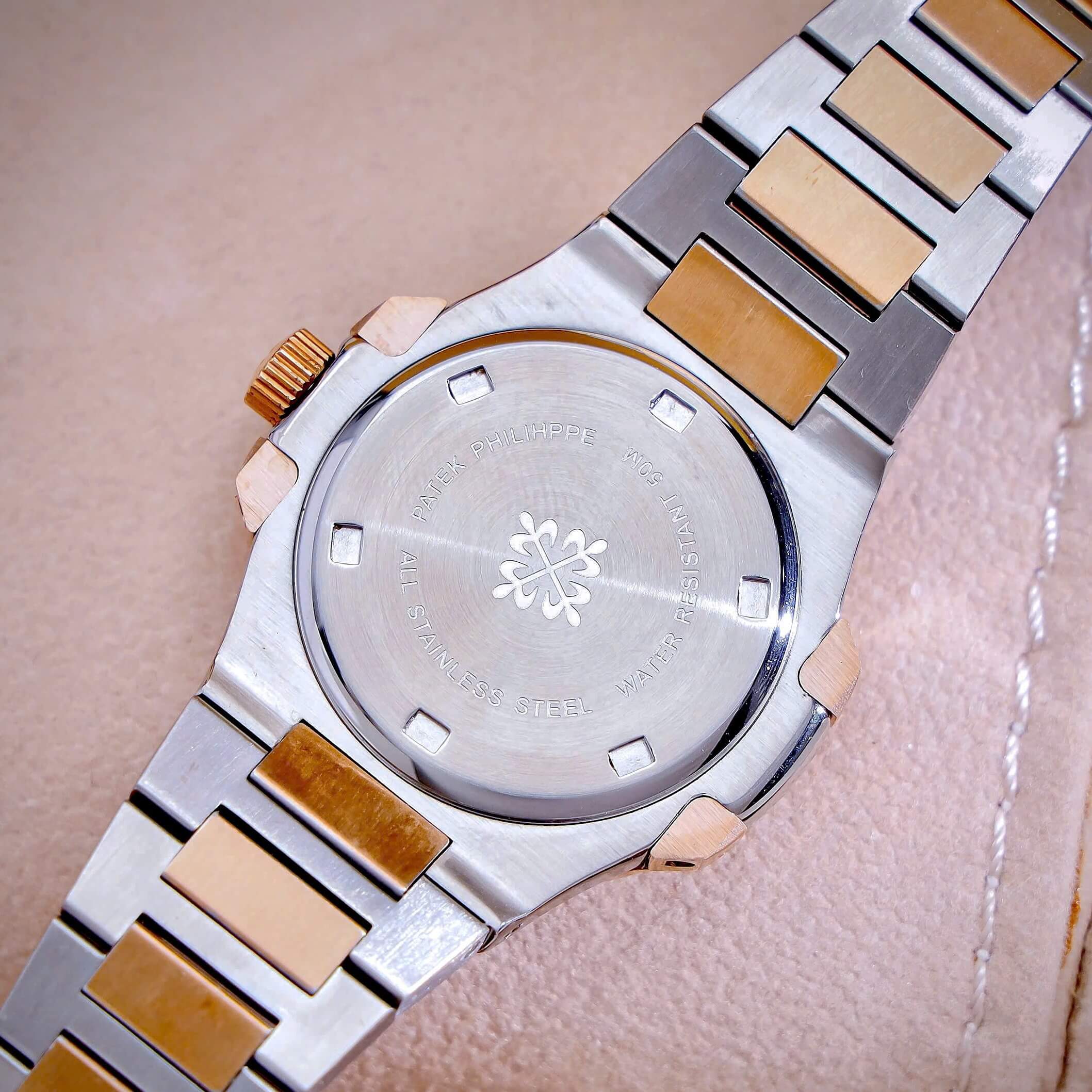 Đồng Hồ Nữ Patek Philippe Nautilus Dây Kim Loại Demi Rose Mặt Ombre Viền Đính Đá 32mm - Quartz