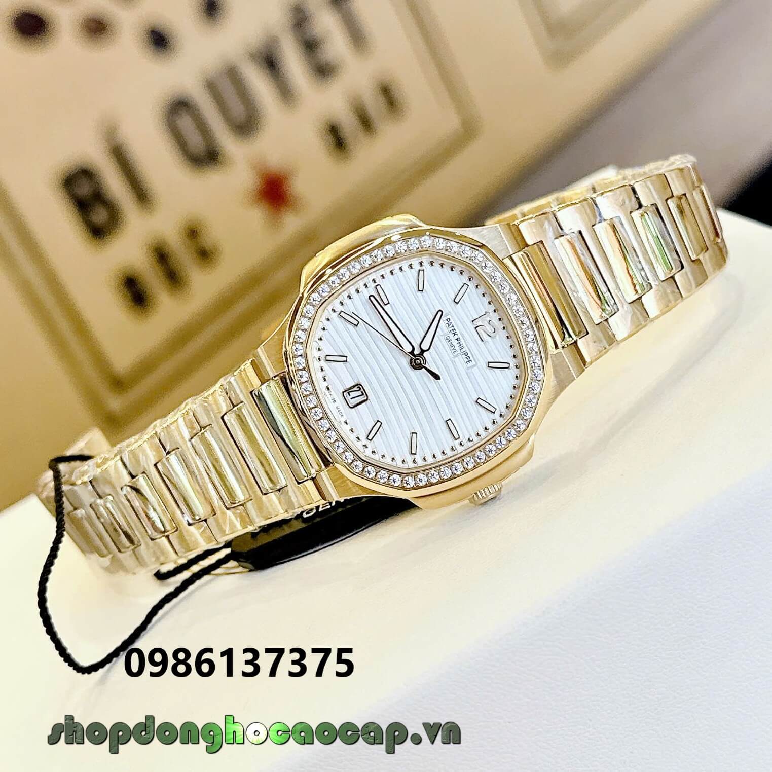 Đồng Hồ Nữ Patek Philippe Nautilus Màu Vàng Gold Mặt Trắng Máy Thụy Sĩ Size 36mm - Viền Đá