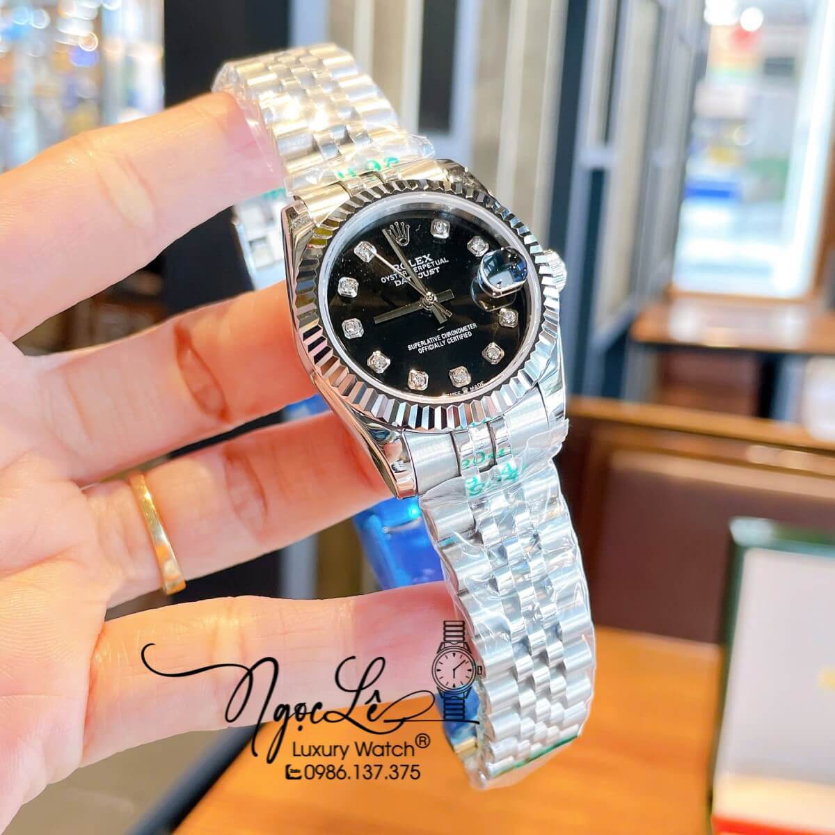 Đồng Hồ Nữ Rolex Datejust Máy Cơ Tự Động Dây Bạc Mặt Đen Niềng Khía Size 31mm