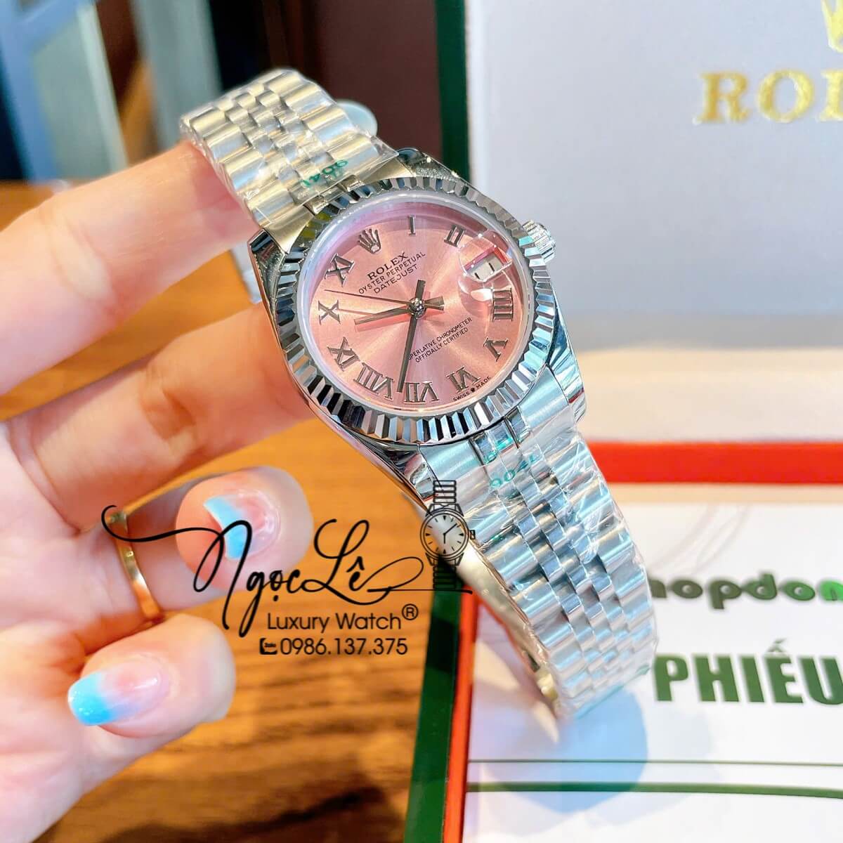 Đồng Hồ Nữ Rolex Datejust Máy Cơ Tự Động Dây Kim Loại Silver Mặt Hồng Niềng Khía Size 31mm - Mặt Số La Mã - Kính Sapphire - Máy Cơ Tự Động Japan - Lịch Ngày Vị Trí 3h  Chiếc Rolex Datejust này là một biểu tượng của sự sang trọng, thanh lịch và đẳng cấp vư