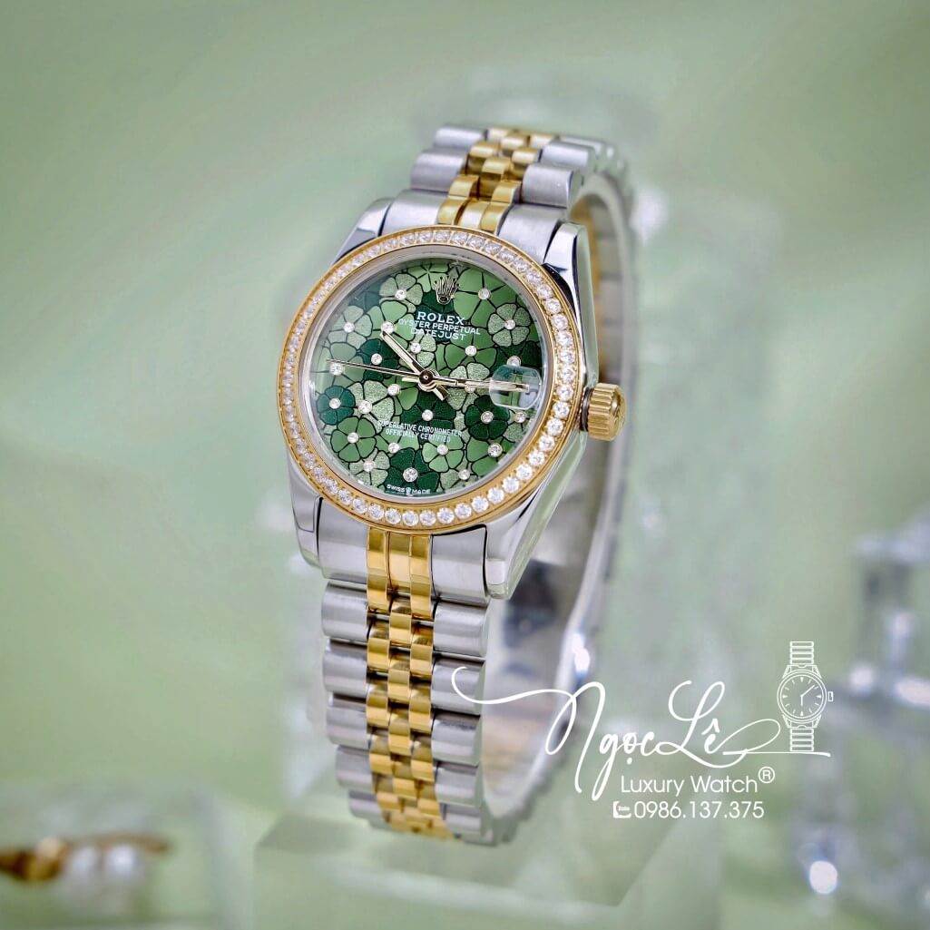 Đồng Hồ Nữ Rolex Datejust Máy Pin Dây Demi Vàng Mặt Hoa Đồng Tiền Xanh Đính Đá Size 31mm