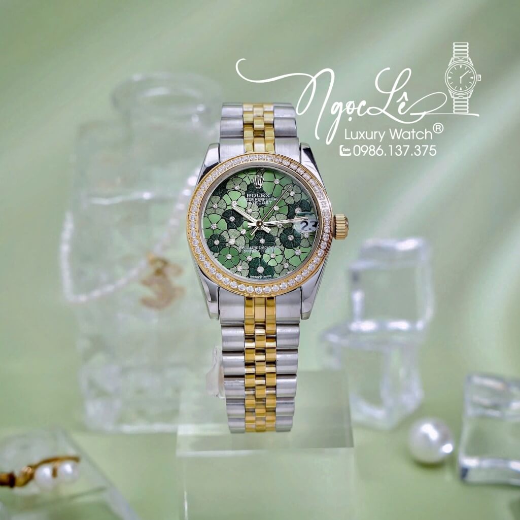 Đồng Hồ Nữ Rolex Datejust Máy Pin Dây Demi Vàng Mặt Hoa Đồng Tiền Xanh Đính Đá Size 31mm