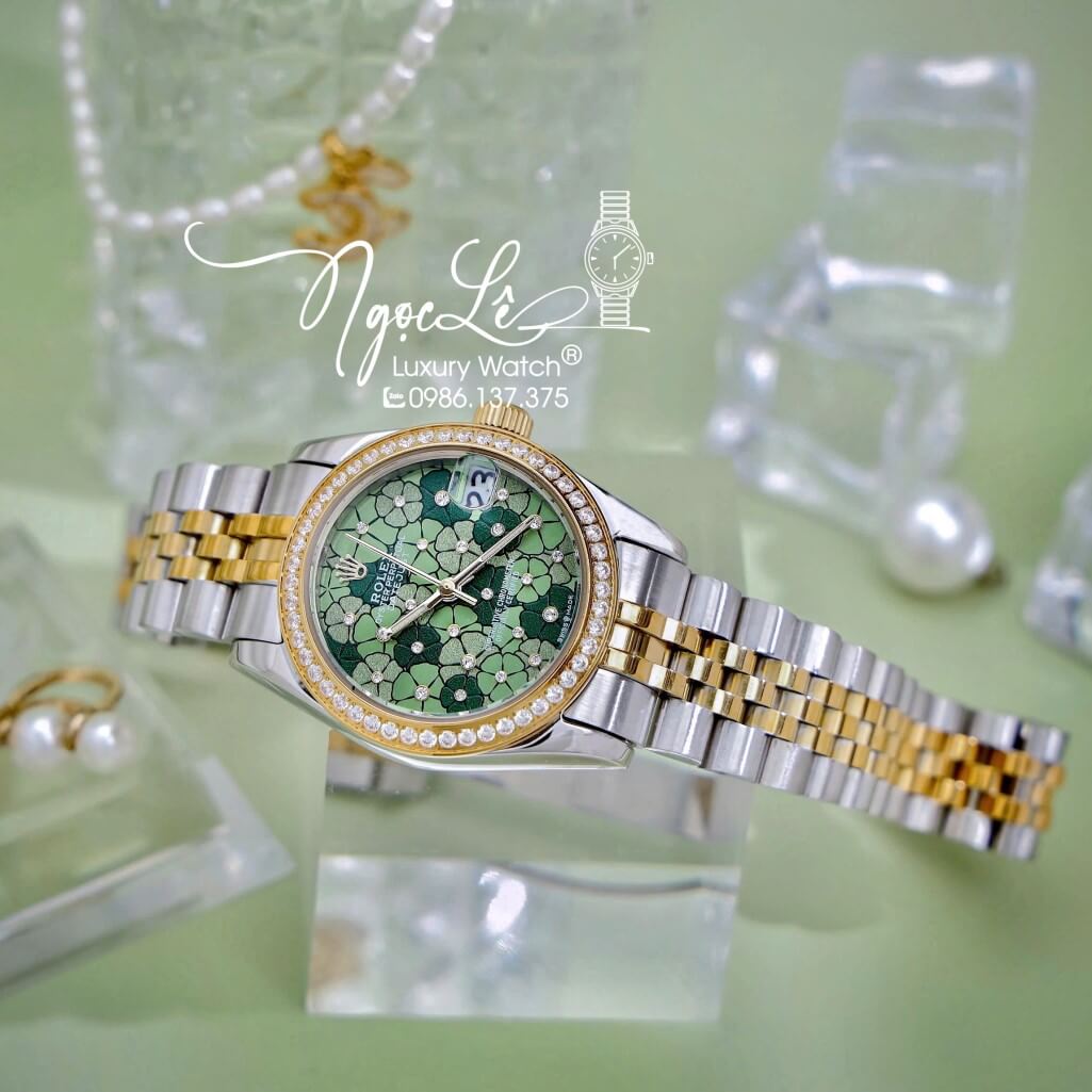 Đồng Hồ Nữ Rolex Datejust Máy Pin Dây Demi Vàng Mặt Hoa Đồng Tiền Xanh Đính Đá Size 31mm