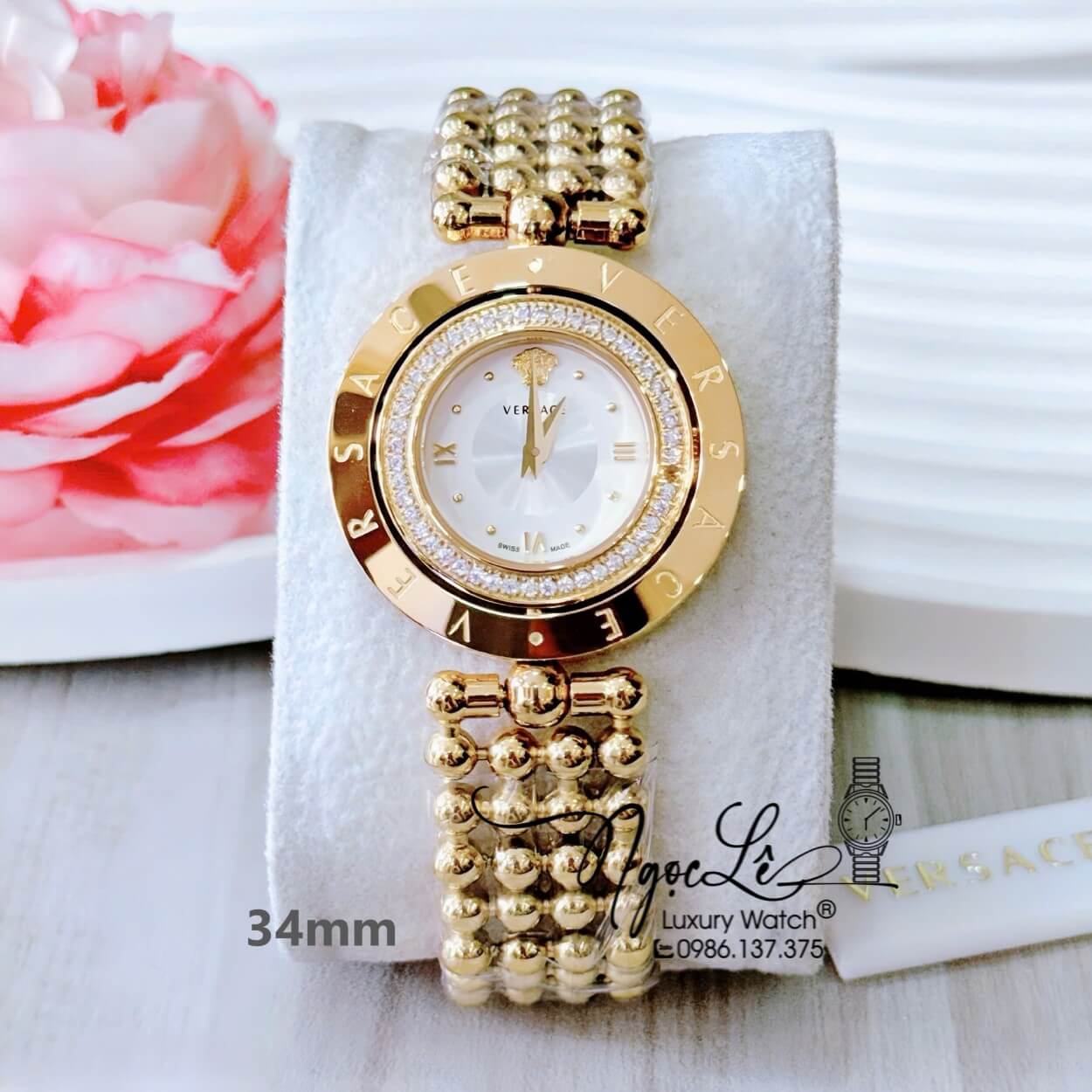 Đồng Hồ Nữ Versace Eon Mặt Xoay 360 Độ Dây Kim Loại Bi Vàng Gold Mặt Trắng Size 34mm Viền Đính Đá