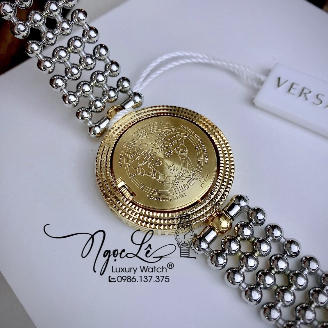 Đồng Hồ Nữ Versace Eon Mother Of Pearl Dây Bi Demi Vàng Mặt Đen Xoay 360 Độ 34mm