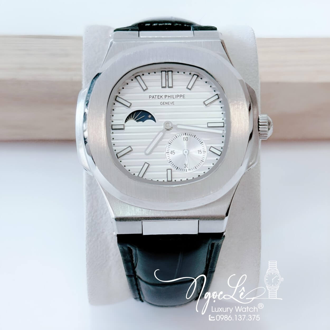 Đồng Hồ Nam Patek Philippe Nautilus Tự Động Dây Da Đen Mặt Trắng Niềng Trơn Size 40mm