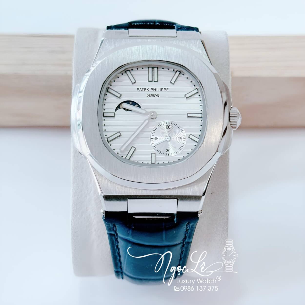Đồng Hồ Nam Patek Philippe Nautilus Tự Động Dây Da Xanh Dương Mặt Trắng Niềng Trơn Size 40mm