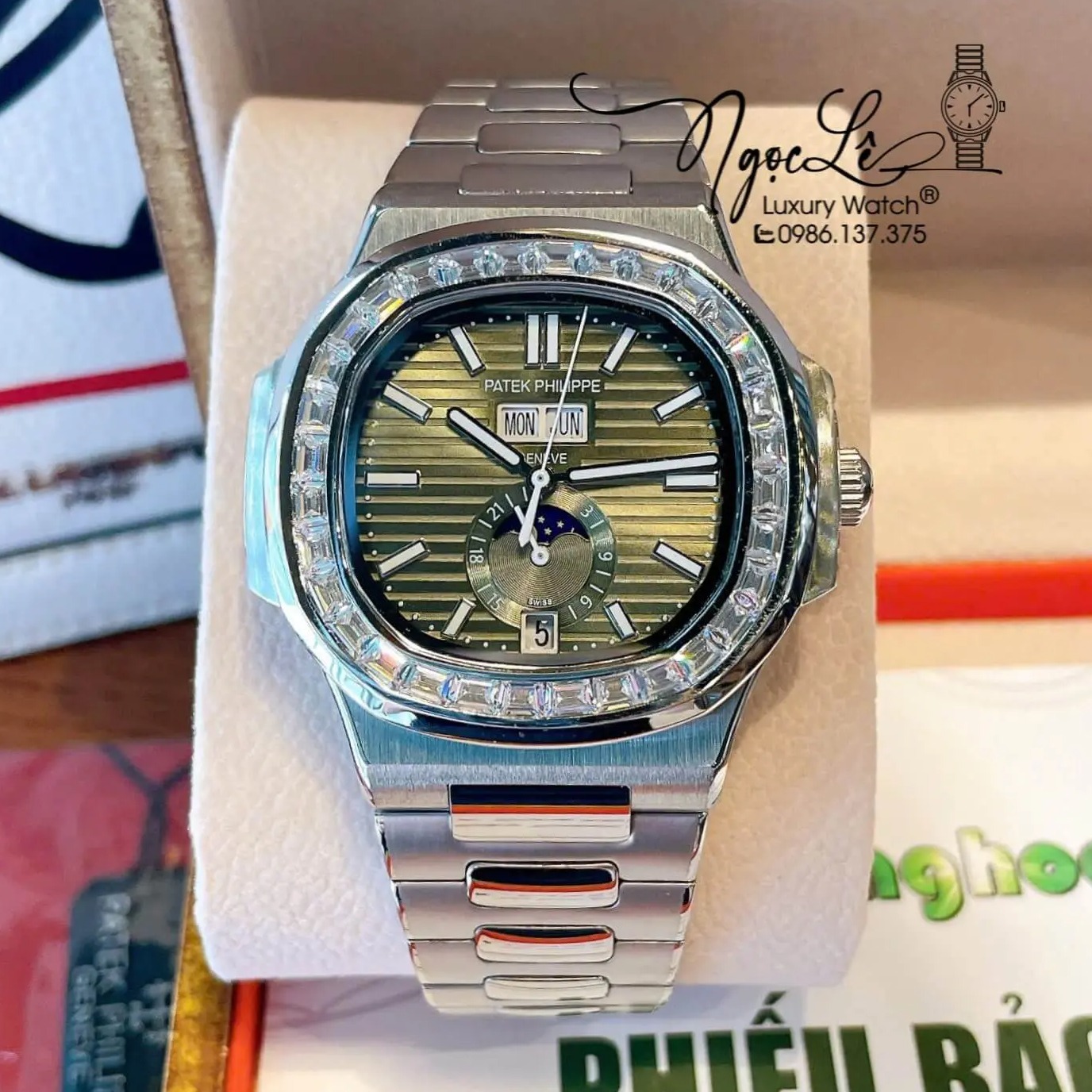 Đồng Hồ Nam Patek Philippe Nautilus Tự Động Dây Kim Loại Silver Mặt Xanh Rêu Lạnh Đính Đá Size 40mm