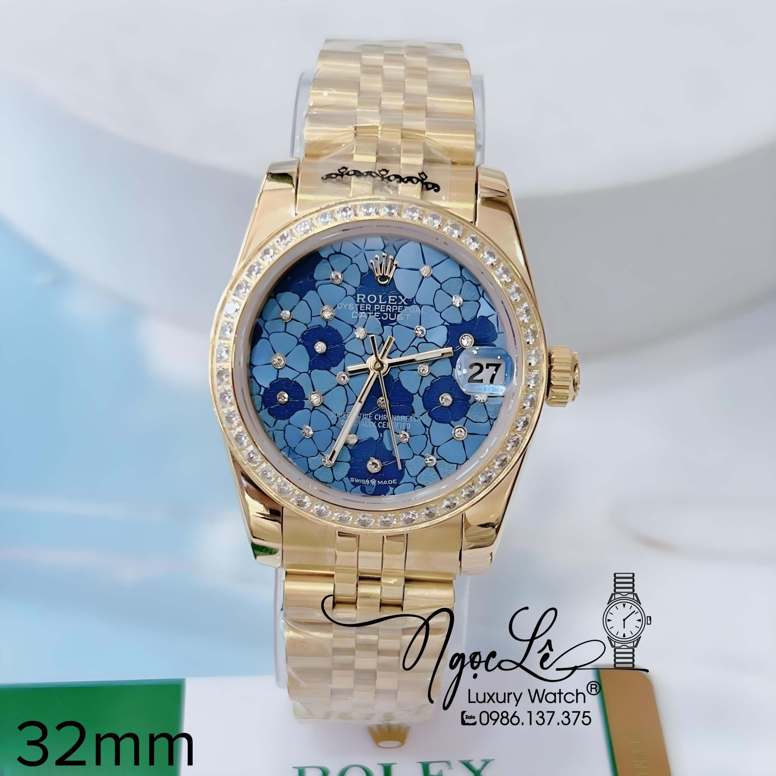 Đồng Hồ Nữ Rolex Datejust Pin Màu Vàng Mặt Hoa Xanh Dương Đính Đá Size 32mm