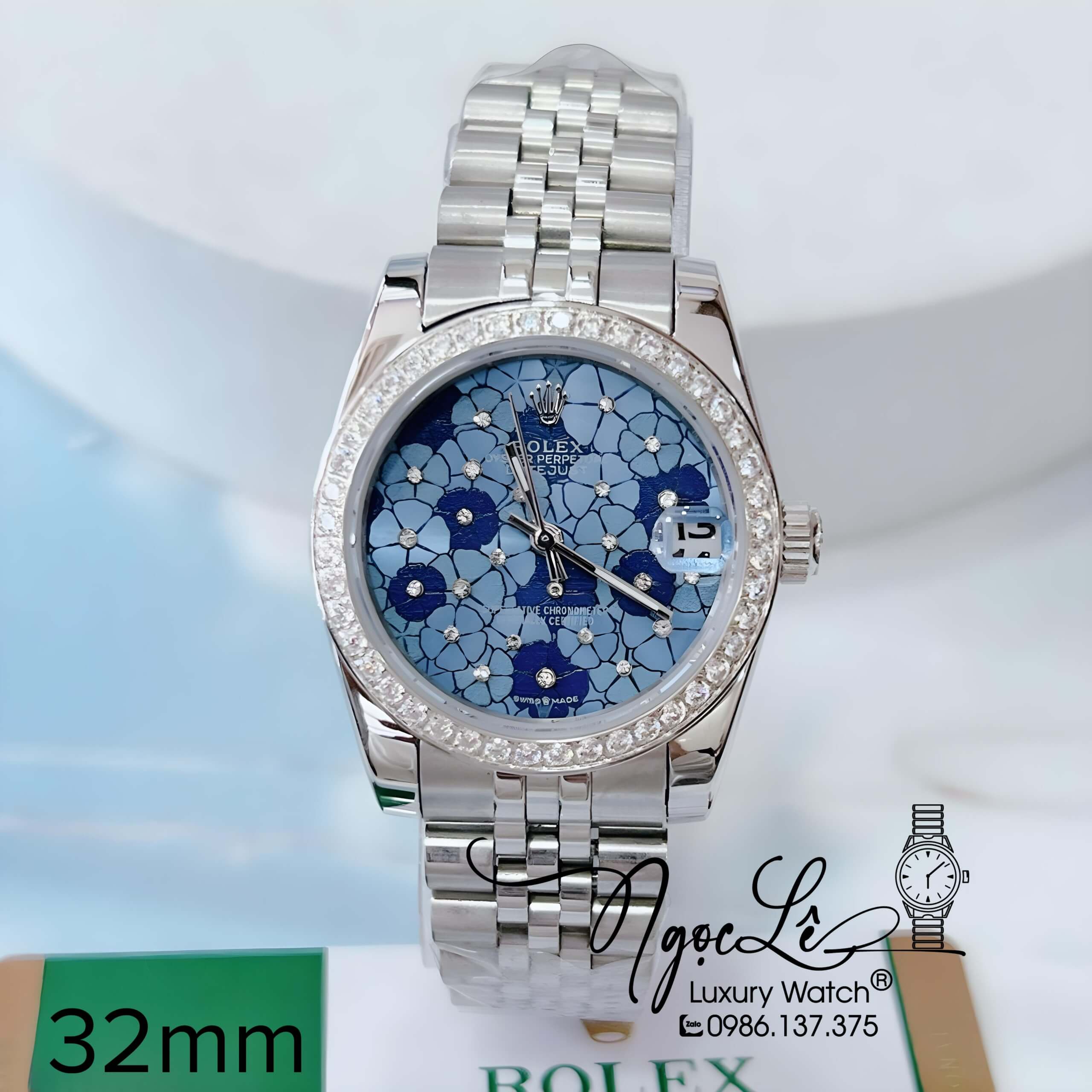 Đồng Hồ Nữ Rolex Datejust Pin Màu Bạc Mặt Hoa Xanh Dương Đính Đá Size 32mm