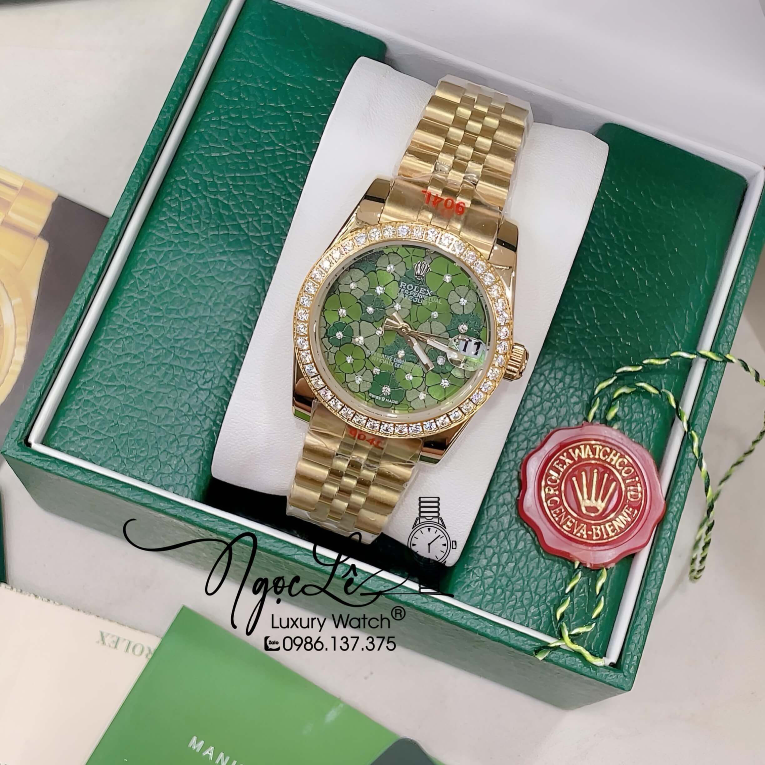 Đồng Hồ Nữ Rolex Datejust Pin Màu Vàng Mặt Xanh Olive Họa Tiết Hoa Đính Đá Size 32mm