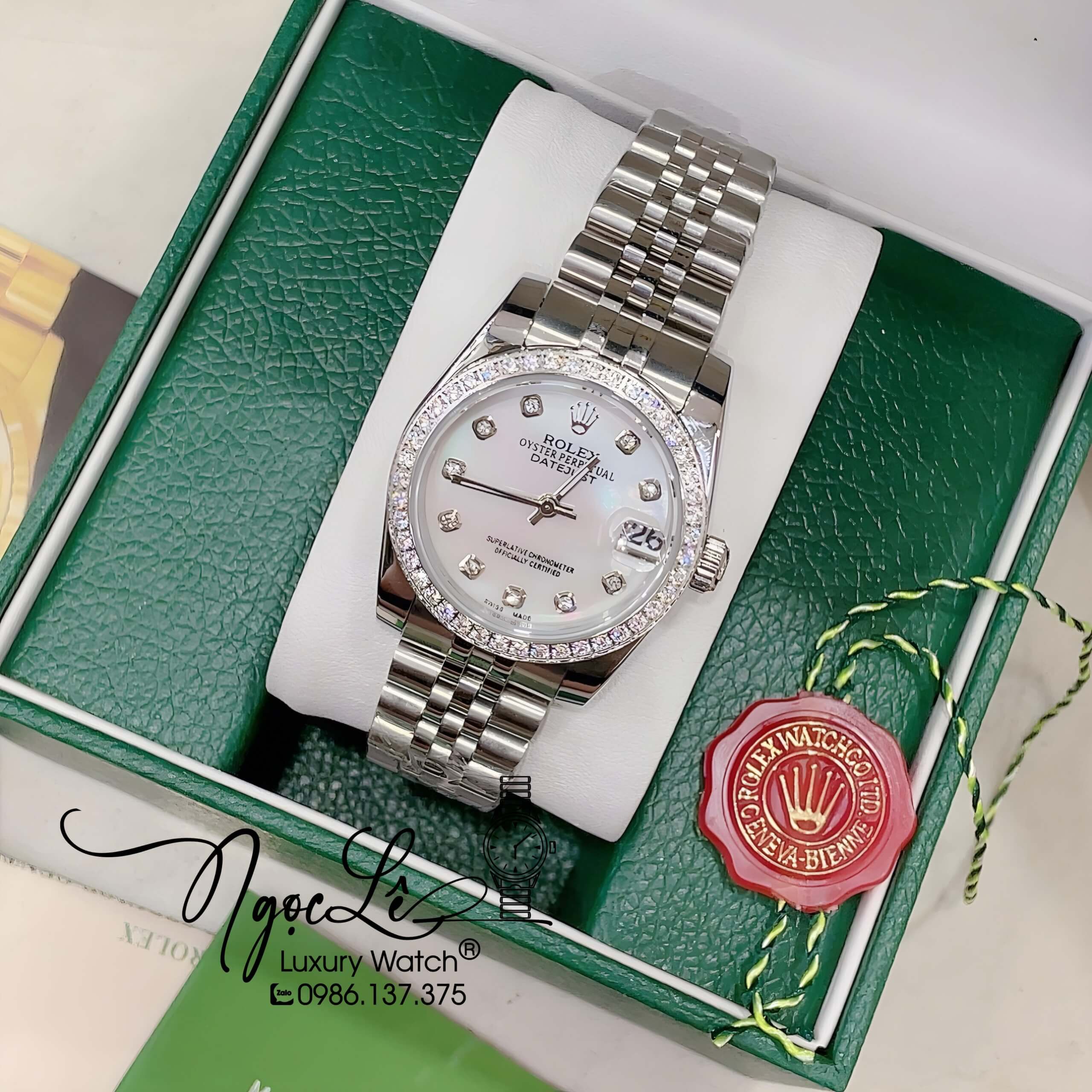 Đồng Hồ Nữ Rolex Datejust Pin Màu Bạc Mặt Trắng Xà Cừ Đính Đá Size 32mm