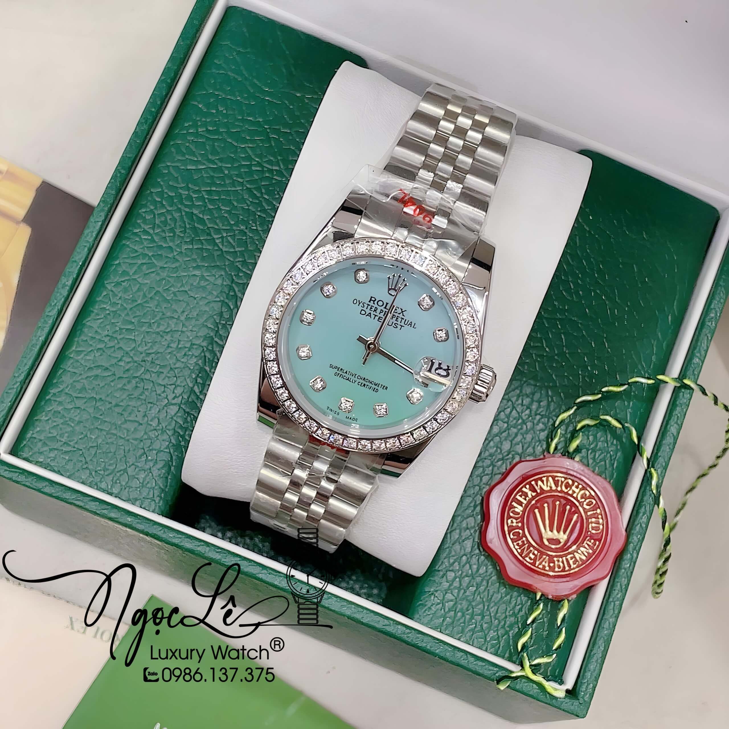 Đồng Hồ Nữ Rolex Datejust Pin Màu Bạc Mặt Xanh Xà Cừ Đính Đá Size 32mm