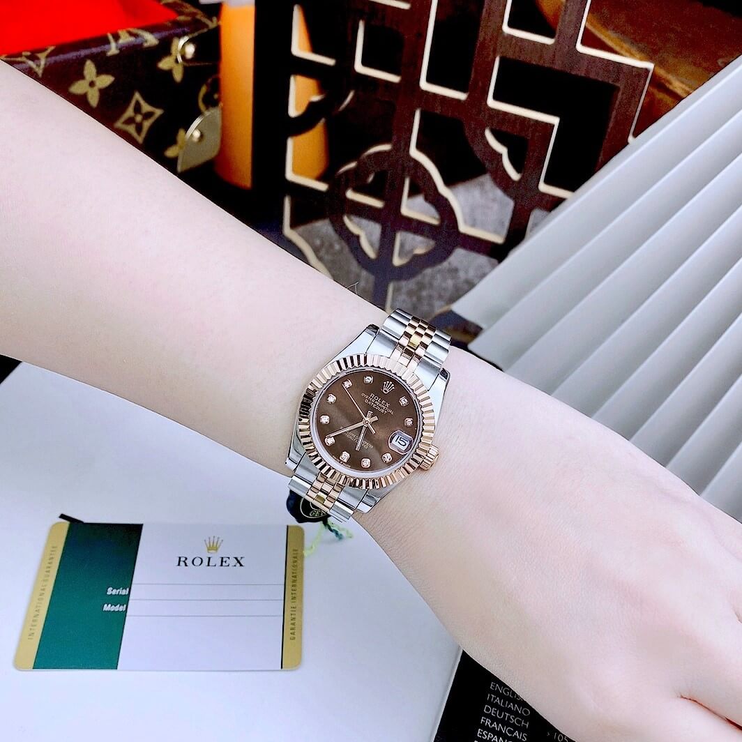 Đồng Hồ Nữ Rolex Datejust Automatic Dây Kim Loại Demi Rose Mặt Nâu Niềng Khía Size 31mm