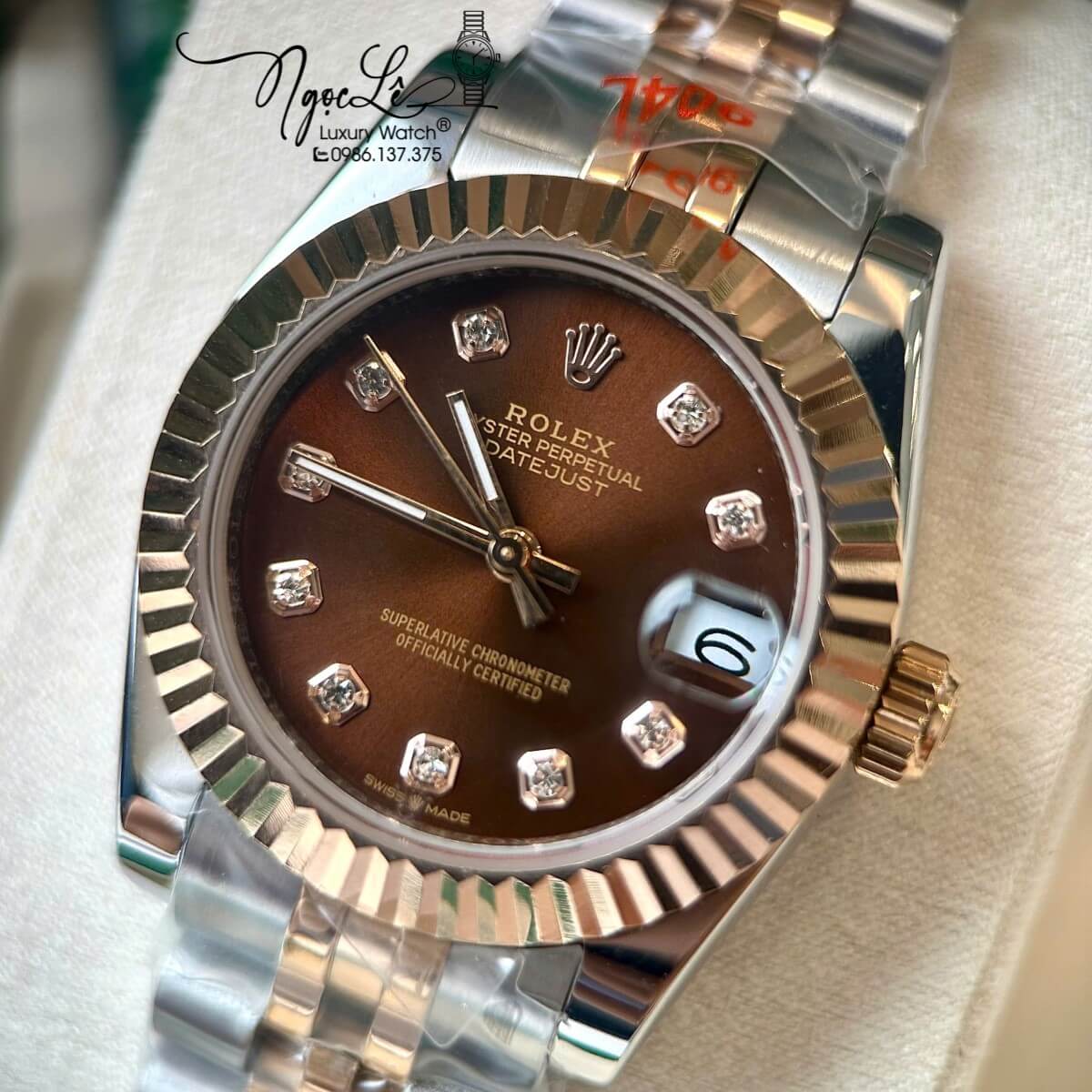 Đồng Hồ Rolex Datejust Nữ Tự Động Dây Kim Loại Demi Rose Mặt Nâu Niềng Khía Size 31mm