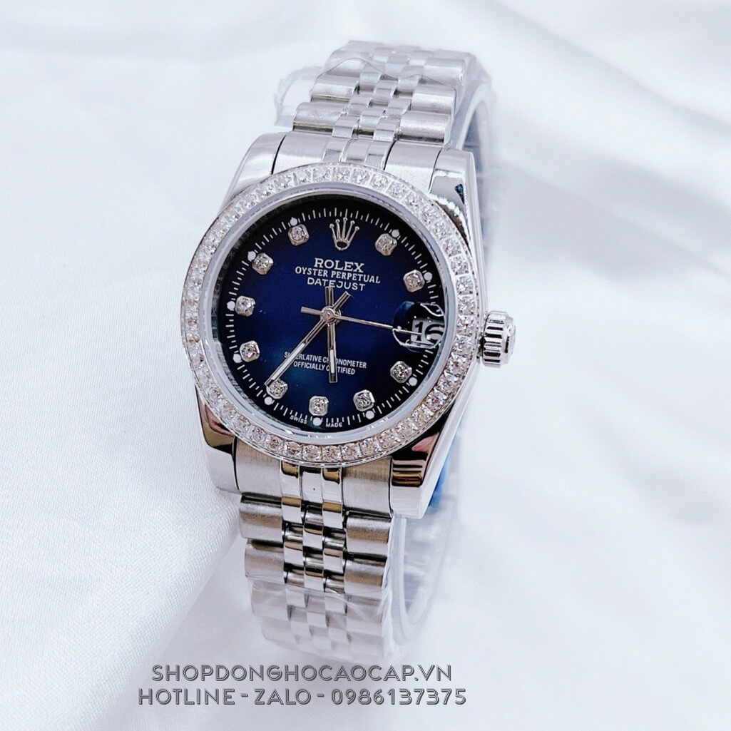 Đồng Hồ Nữ Rolex Datejust Kim Loại Bạc Mặt Xanh Đậm Viền Đá 32mm