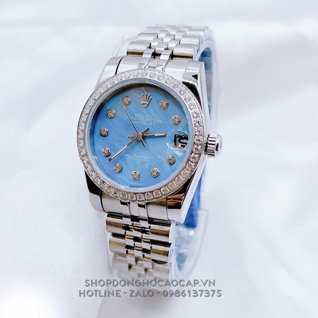 Đồng Hồ Nữ Rolex Datejust Kim Loại Bạc Mặt Xanh Xà Cừ Viền Đá 32mm