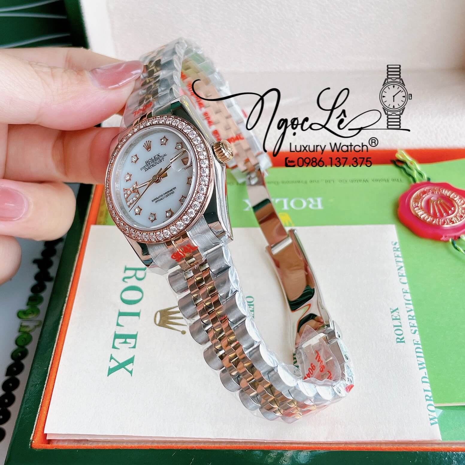 Đồng Hồ Nữ Rolex Datejust Pin Màu Demi Rose Mặt Trắng Xà Cừ Đính Đá Size 32mm