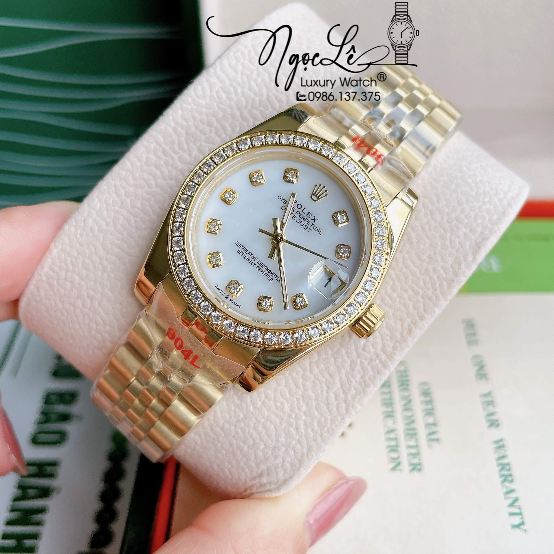 Đồng Hồ Nữ Rolex Datejust Pin Màu Vàng Mặt Trắng Xà Cừ Đính Đá Size 32mm Full Box