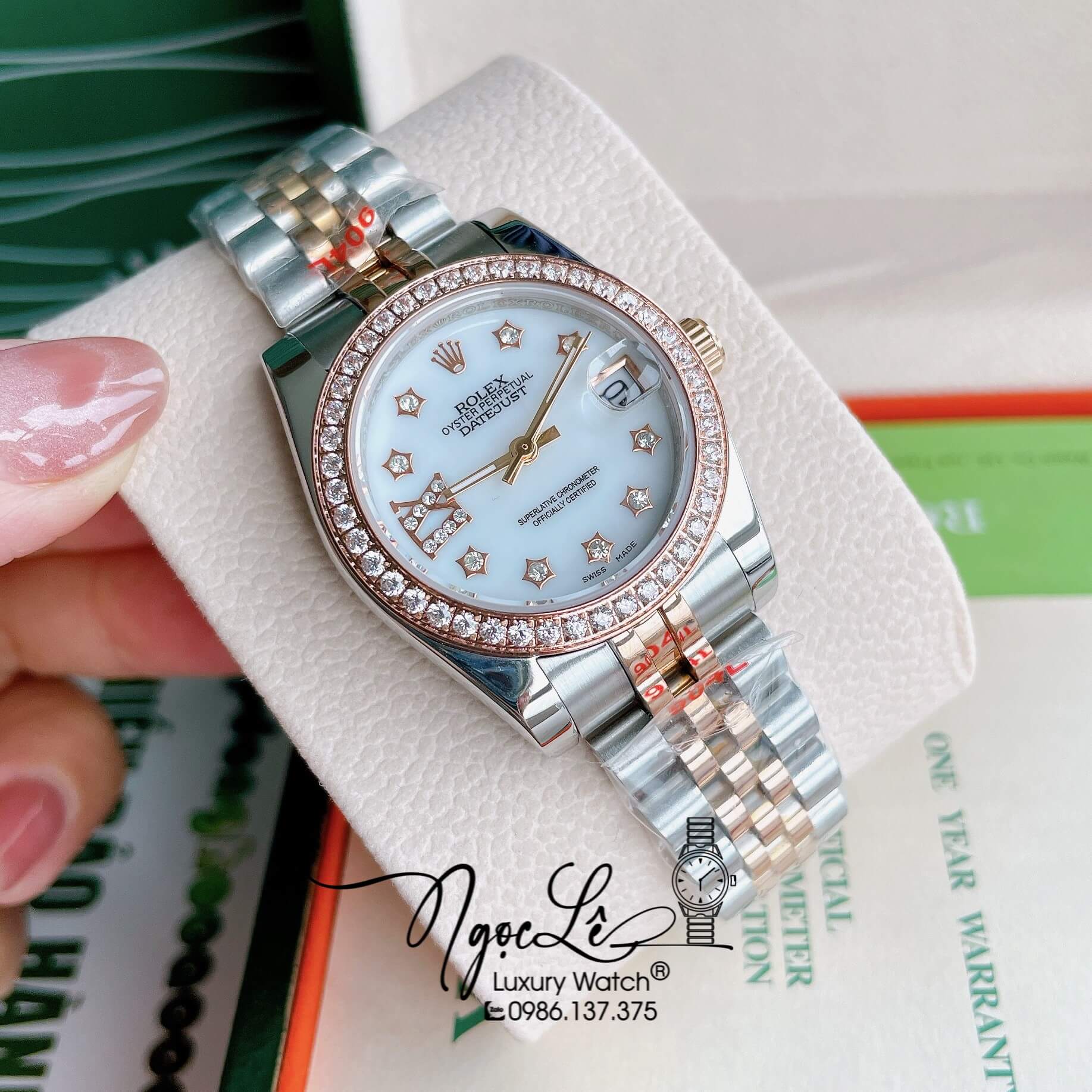 Đồng Hồ Nữ Rolex Datejust Pin Màu Demi Rose Mặt Trắng Xà Cừ Đính Đá Size 32mm