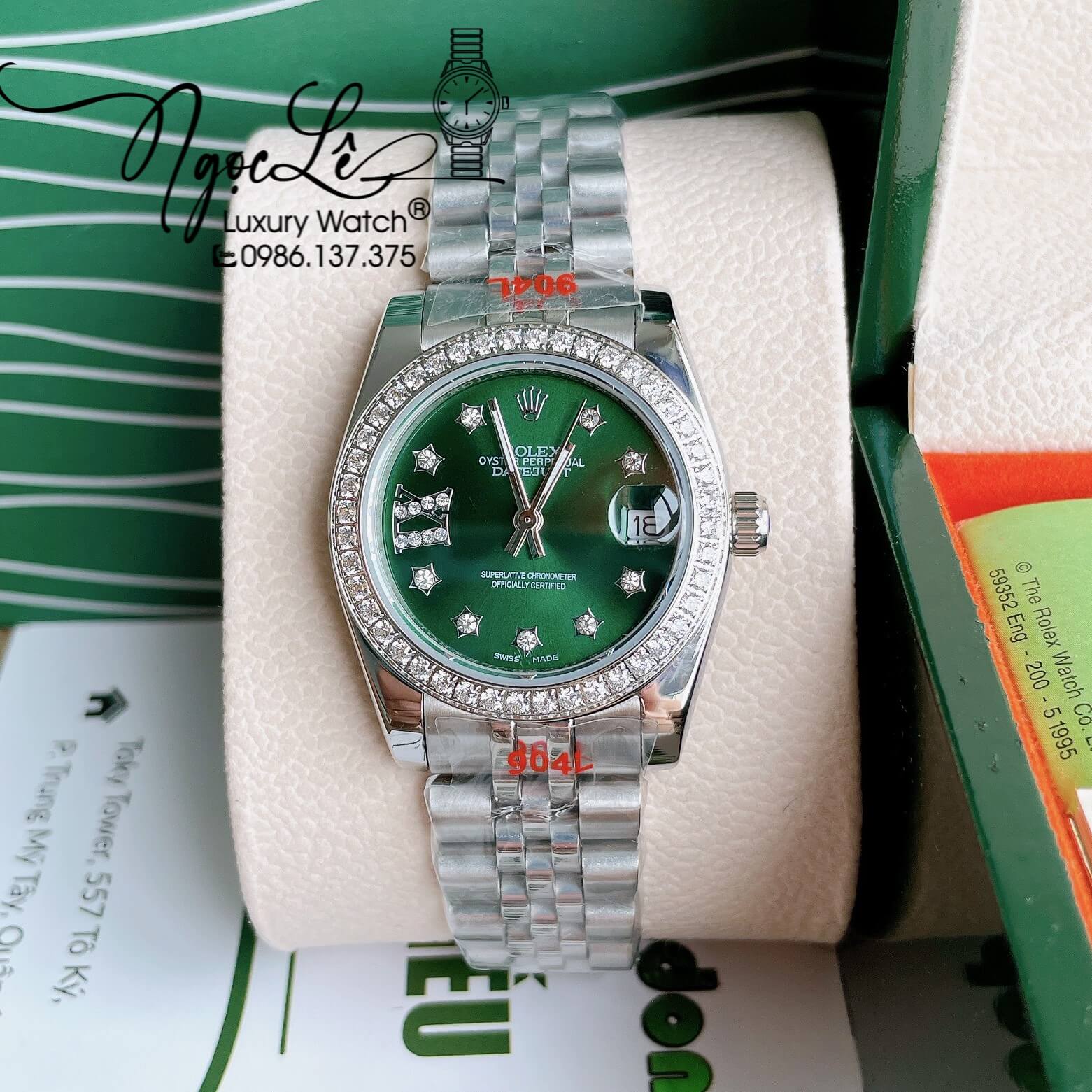 Đồng Hồ Nữ Rolex Datejust Pin Màu Bạc Mặt Xanh Oliu Đính Đá Size 32mm