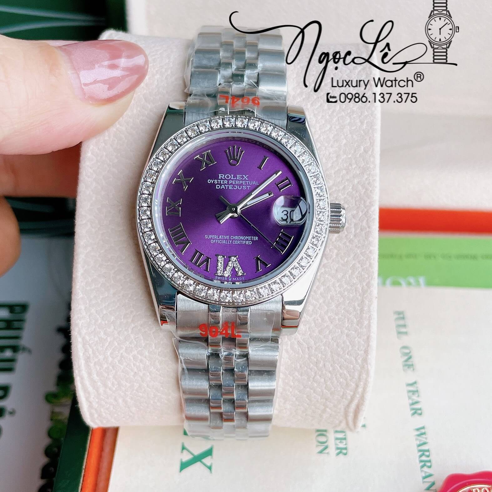 Đồng Hồ Nữ Rolex Datejust Pin Màu Bạc Mặt Tím Đính Đá Size 32mm Full Box