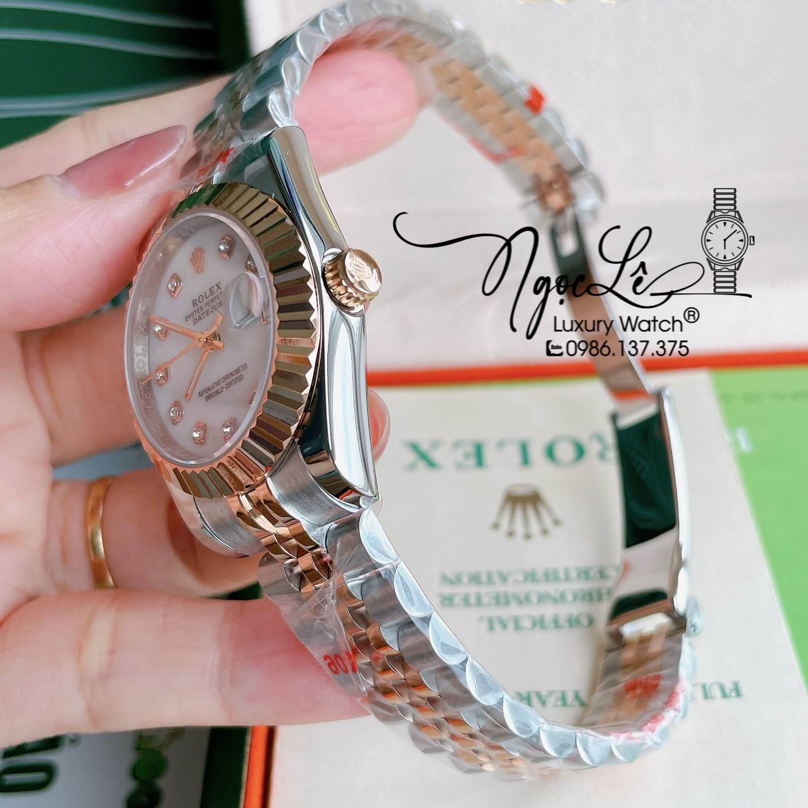 Đồng Hồ Nữ Rolex Datejust Pin Màu Demi Rose Mặt Trắng Xà Cừ Khía Size 32mm