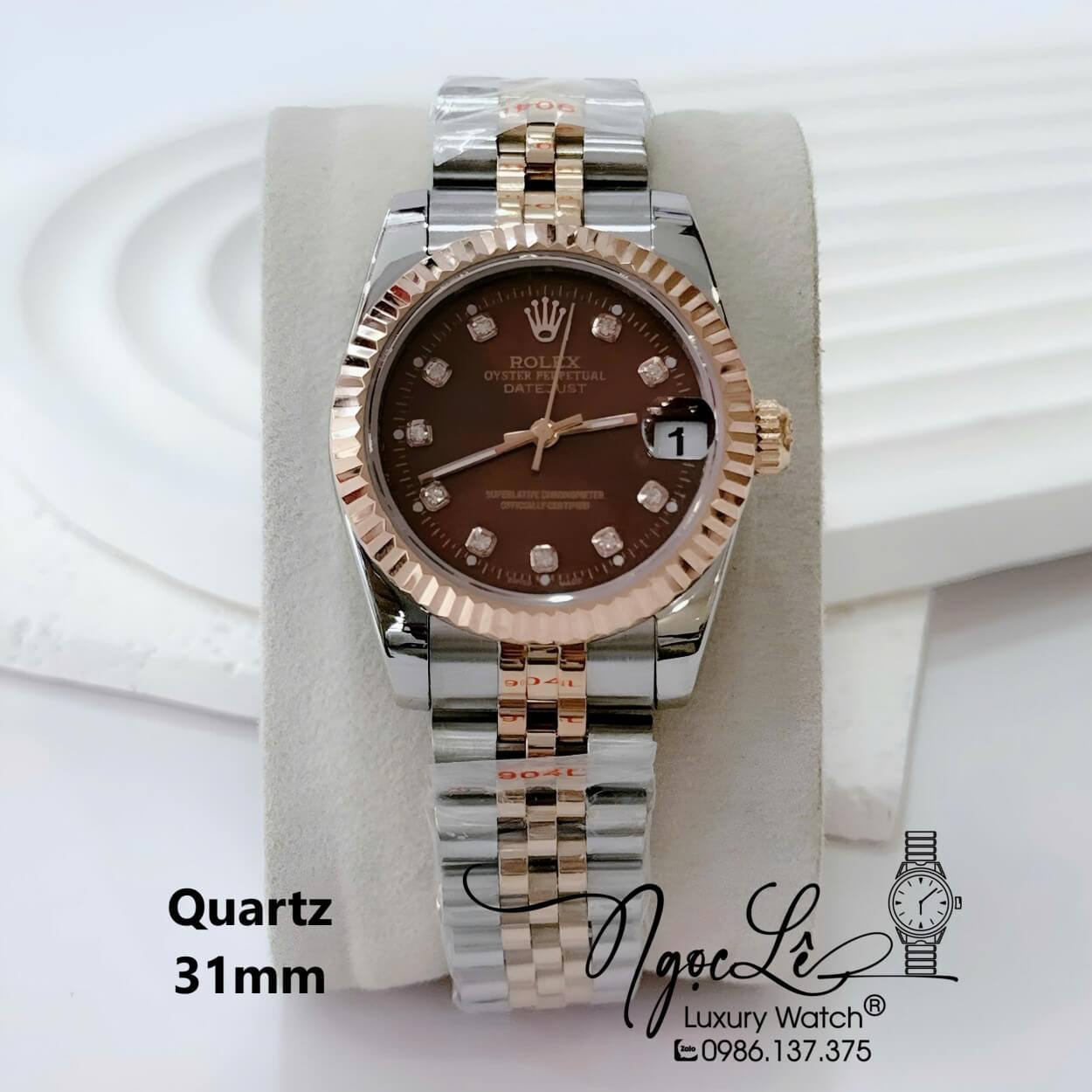 Đồng Hồ Nữ Rolex Datejust Pin Dây Kim Loại Demi Rose Mặt Nâu Size 31mm
