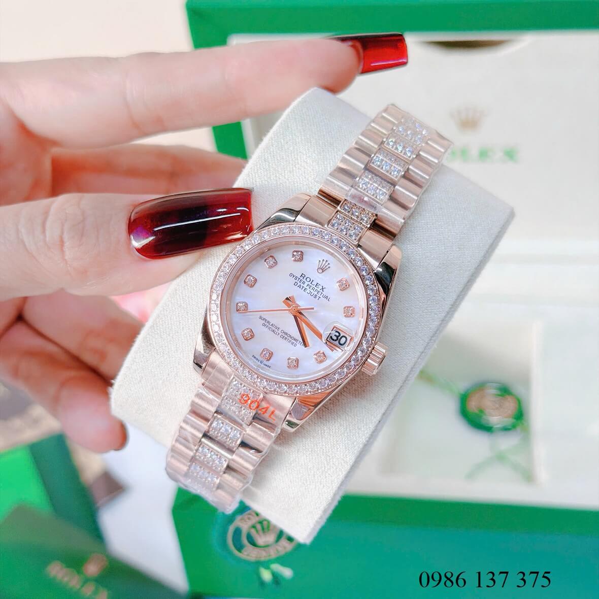 Đồng Hồ Nữ Rolex Datejust Viền Đá Mặt Trắng Xà Cừ Dây Kim Loại Vàng Hồng Đính Đá Size 31mm