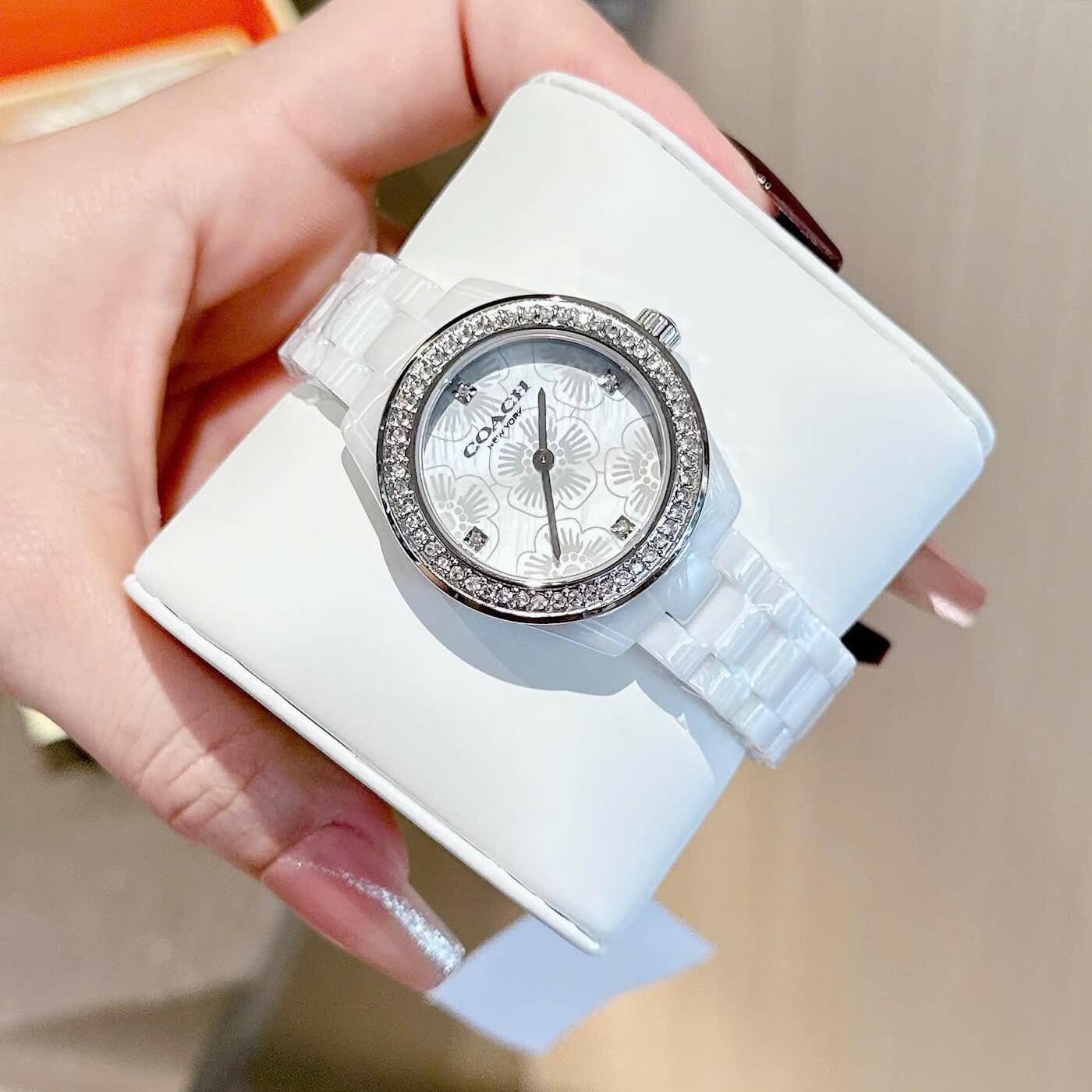 Đồng Hồ Nữ Coach Ceramic Trắng Viền Đá Mặt Họa Tiết Hoa Trà Size 33mm Vỏ Silver Quartz