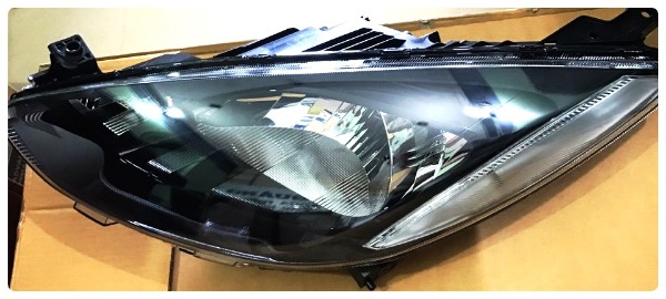 Đèn pha Mazda 2 2012