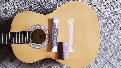 Sửa đàn guitar bong cầu ngựa đàn